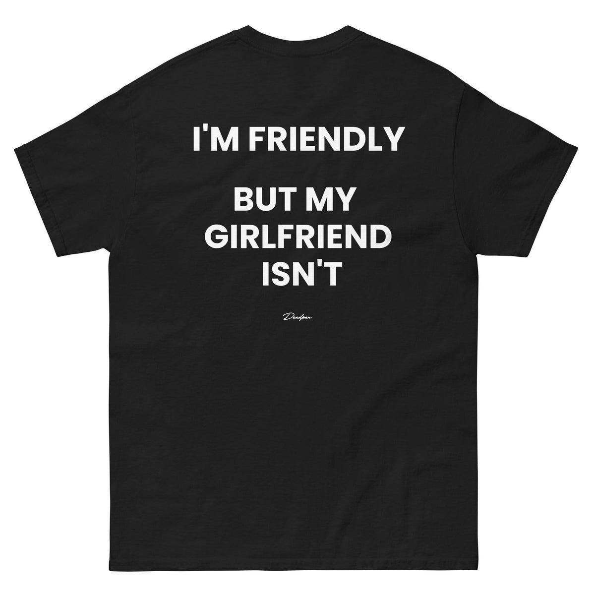 T-shirt unisex nero con scritta "I'm friendly, but my girlfriend isn't" di UNTLD, vista di schiena e stile casual.